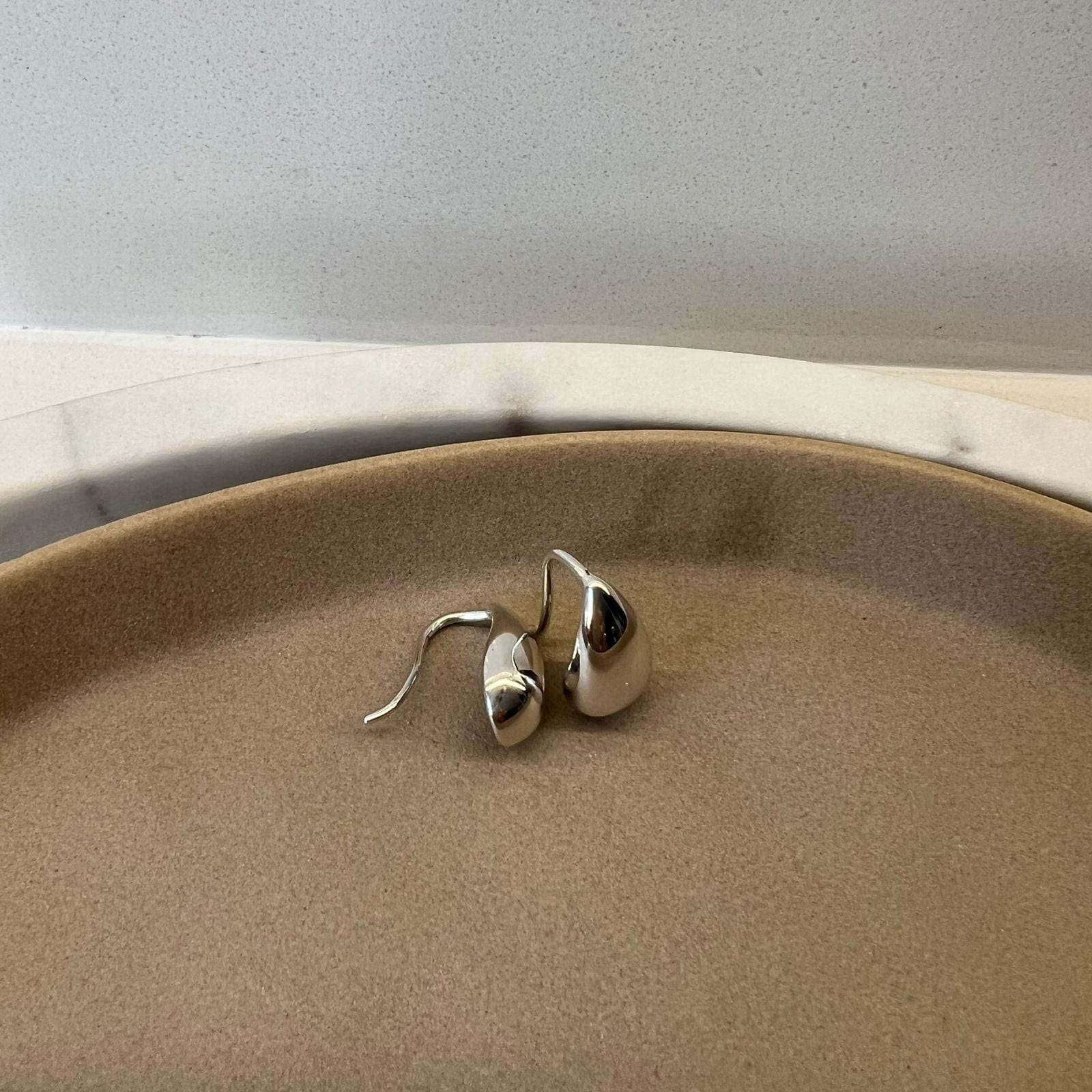 Dewdrop Earrings Suprene Collective flat lay silver and gold