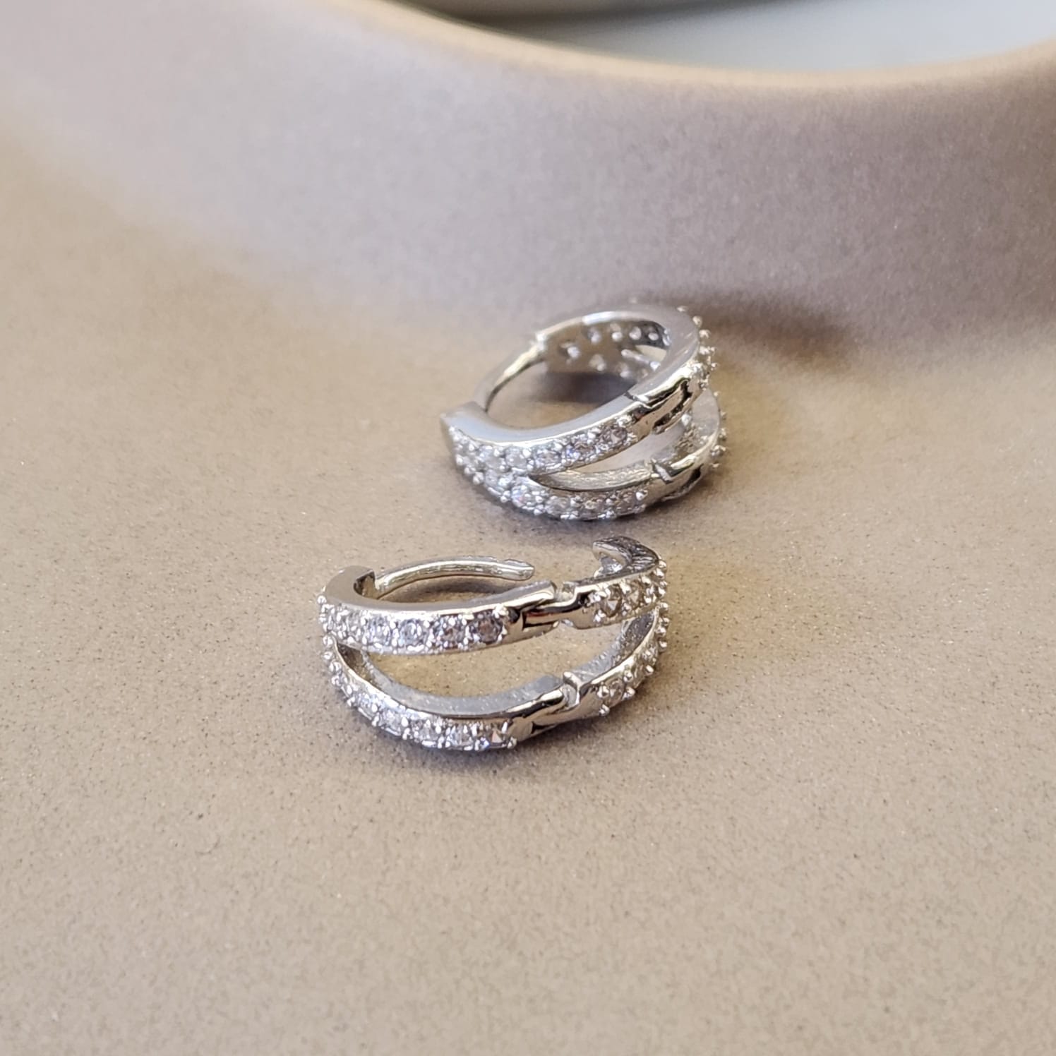 Double Hoop Huggie Earrings pavé CZ stones close up 11x6mm