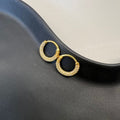 CZ Crusted Huggie Earrings gold tone huggie fit worn on ear