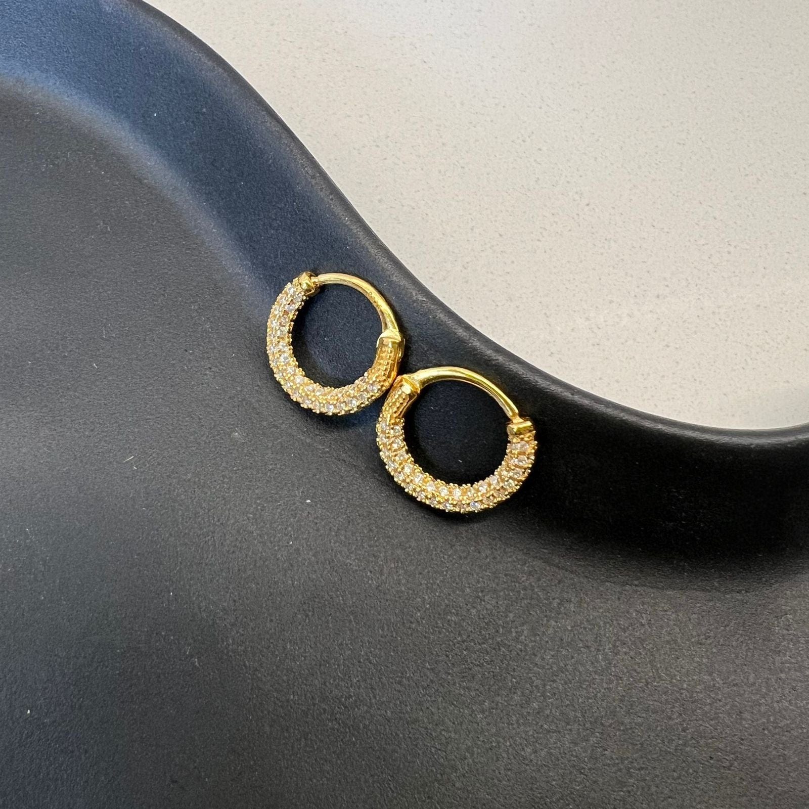 CZ Crusted Huggie Earrings gold tone huggie fit worn on ear