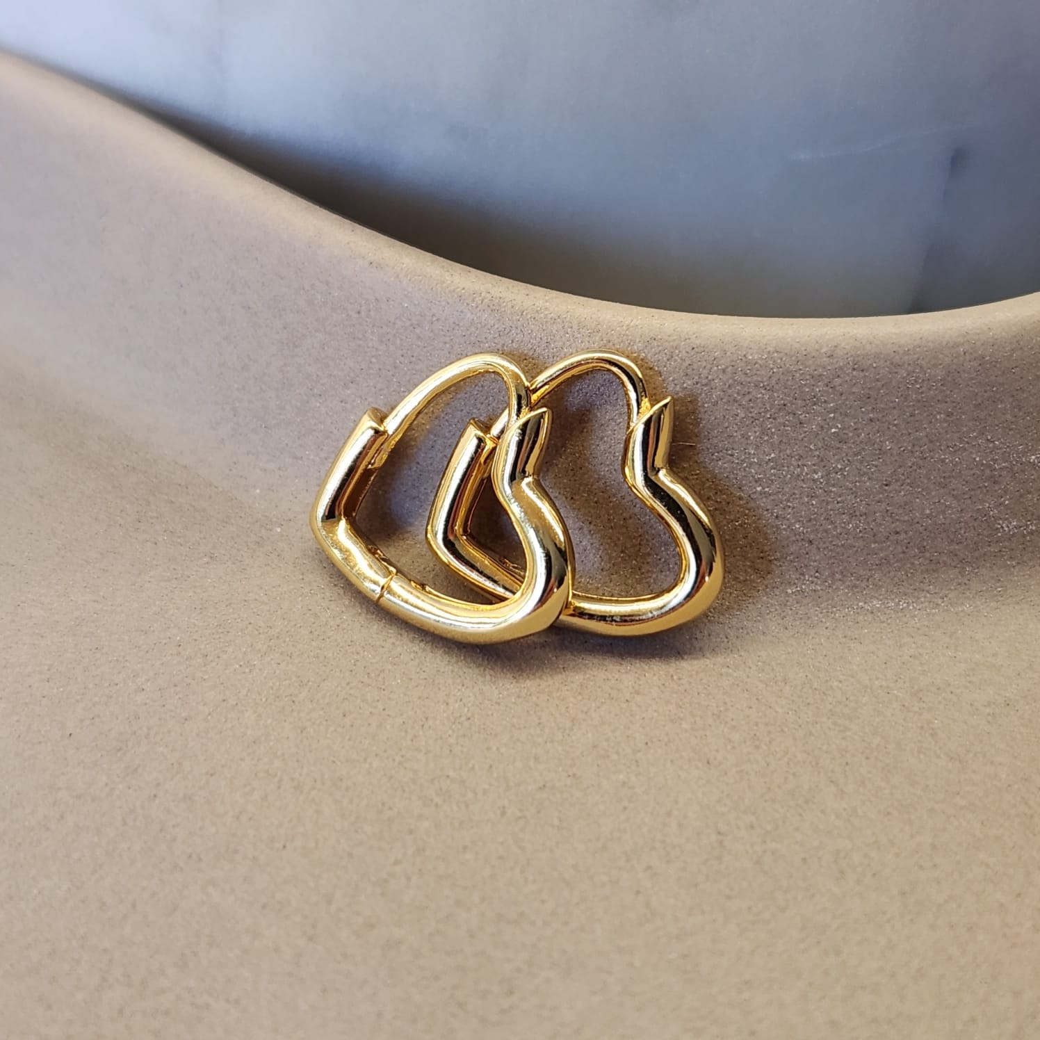 Heart Huggie Earrings gold tone platinum plated worn on ear