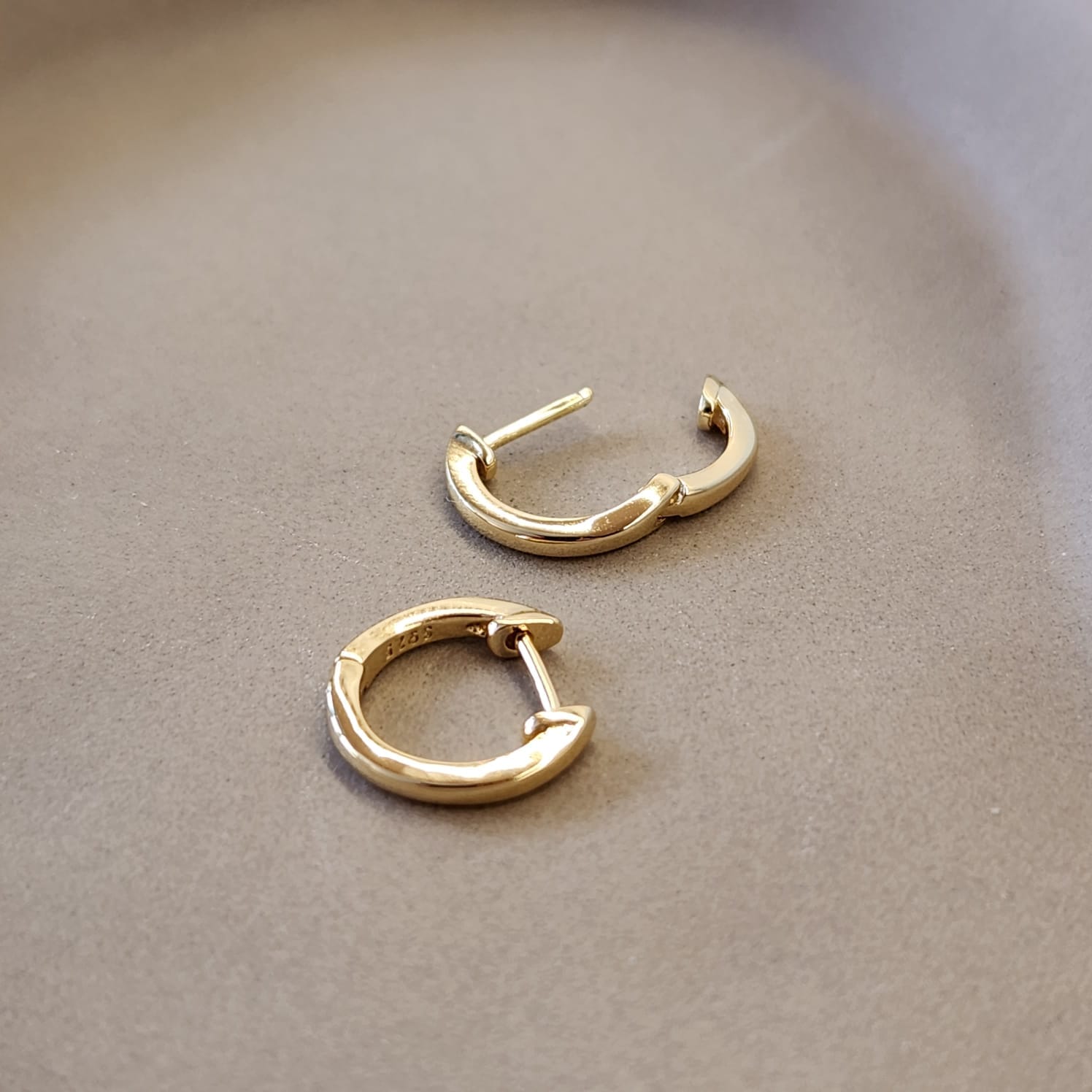 Minimal Huggie Earrings smooth round hoop S925 stamp close up