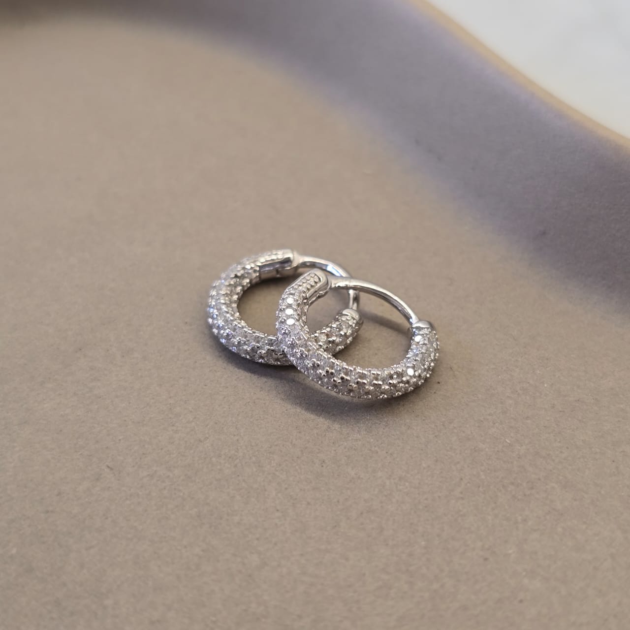 Suprene Collective CZ Crusted Huggie Earrings silver tone 925 Sterling Silver full CZ setting