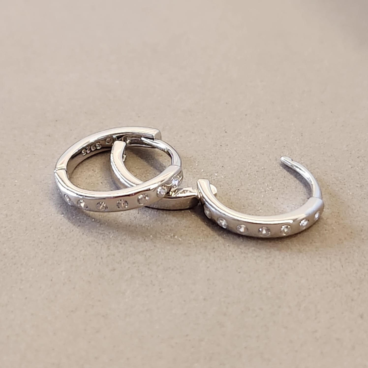 Spaced Zircon Huggie Earrings silver tone S925 stamp inner face