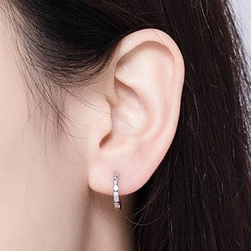 Spaced Zircon Huggie Earrings 1.3cm 925 Sterling Silver worn on ear