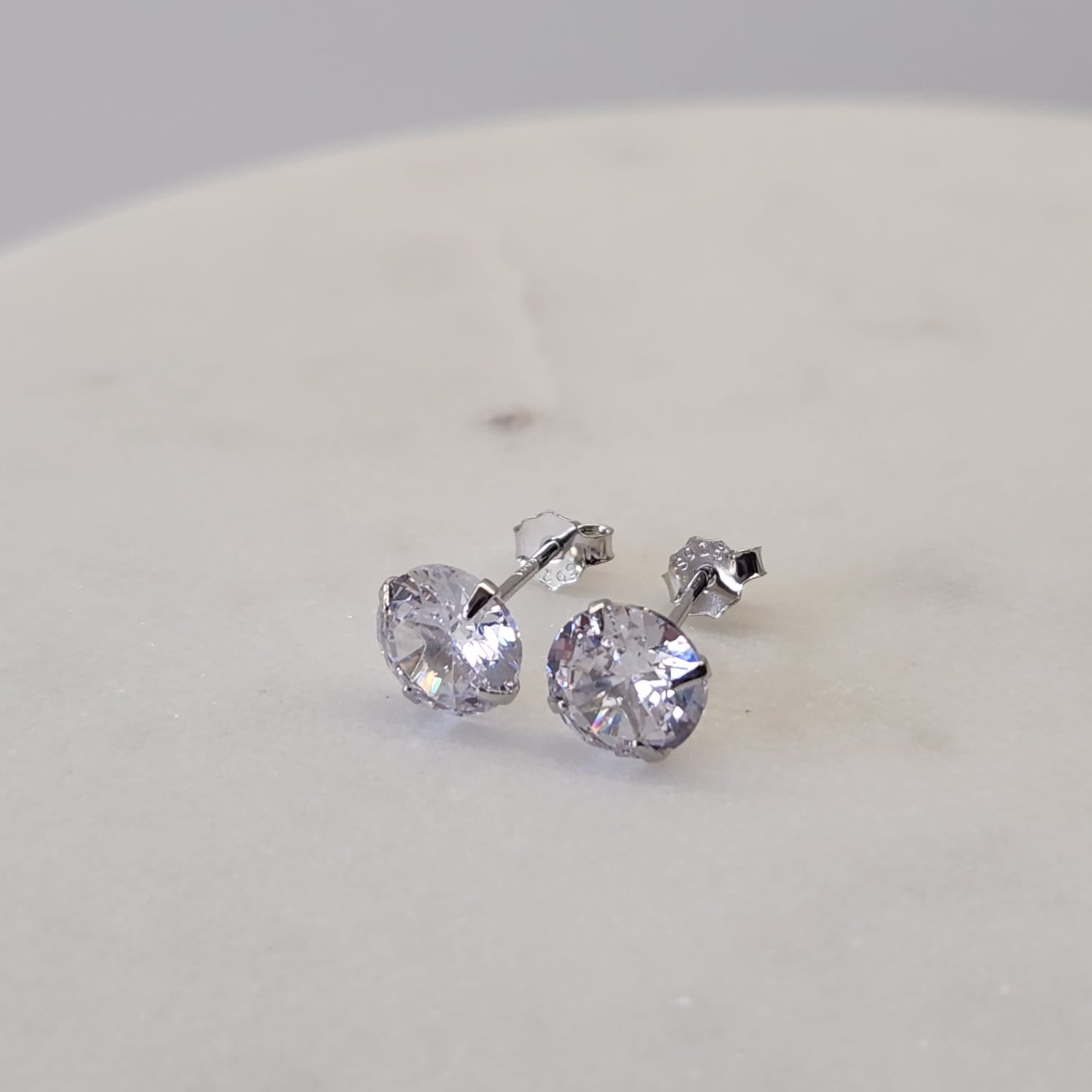 Suprene Collective CZ Stud Earrings 925 Sterling Silver four-claw pavé setting platinum plated