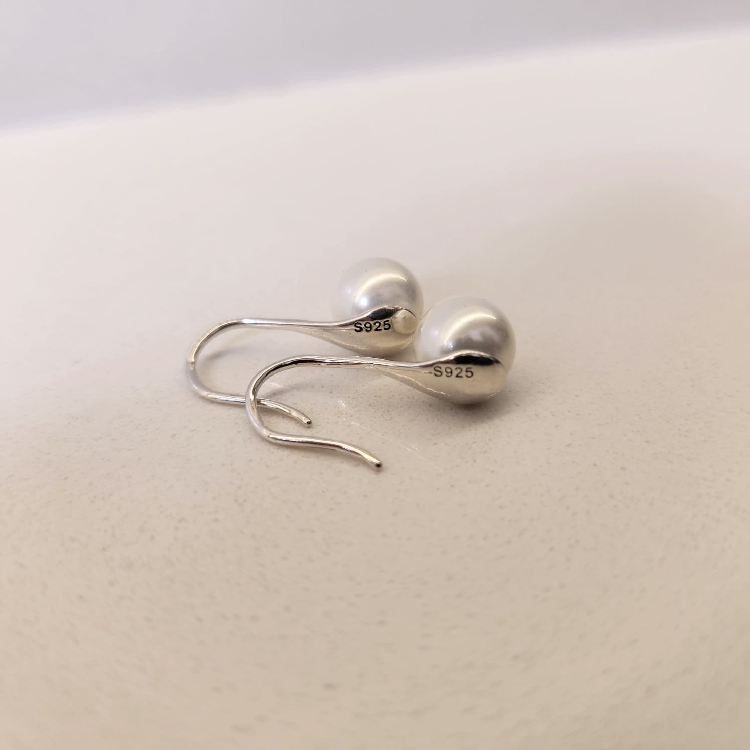 Pearl Drop Earrings smooth shell pearl close up high gloss finish