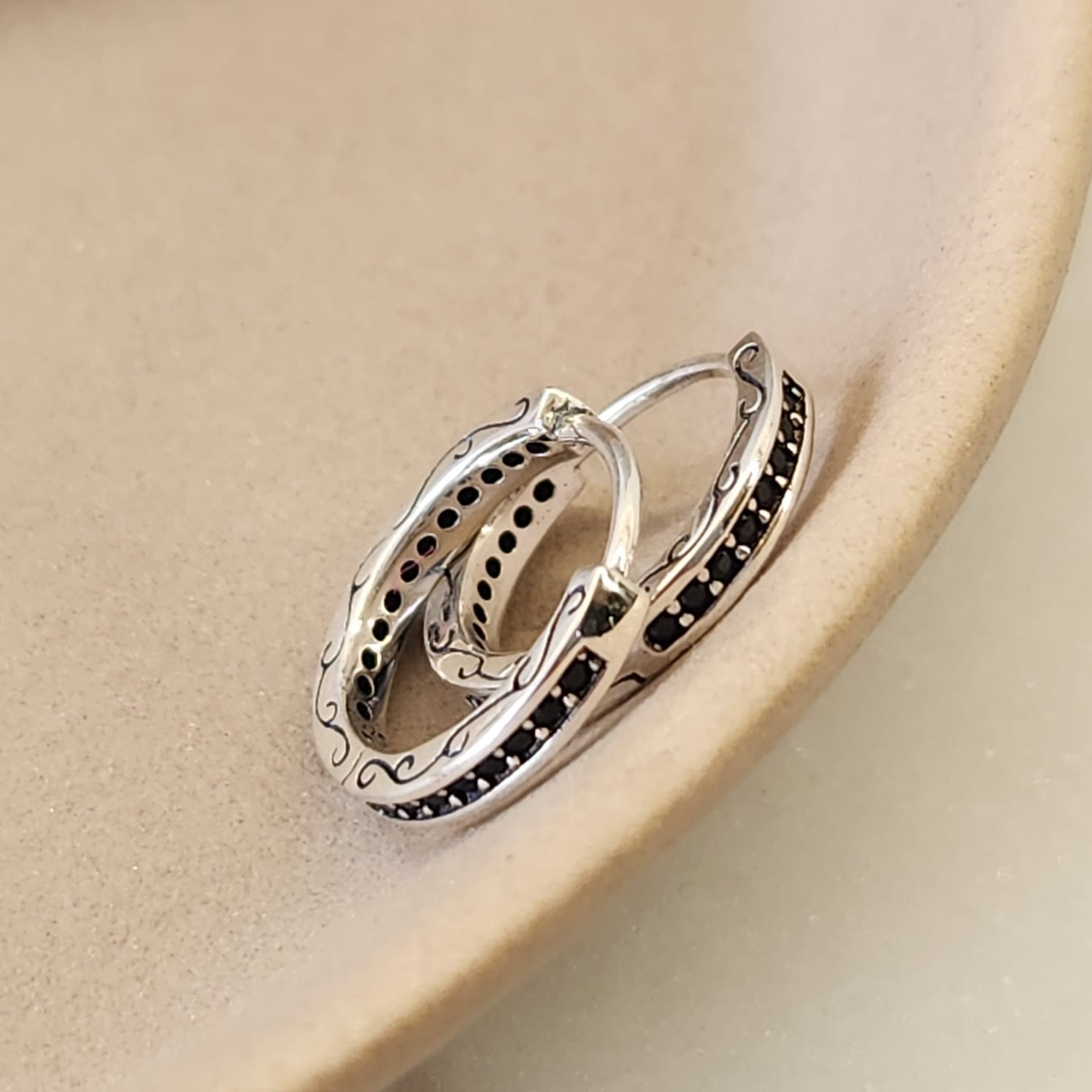 Black Zircon Stone Huggie Earrings worn on ear 1.3cm 925 silver