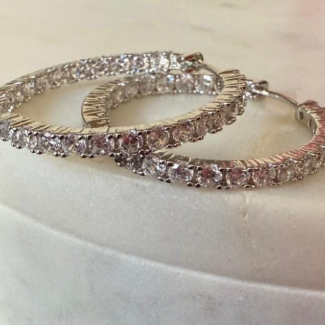 Zirconia Eternity Hoop Earrings silver tone flat lay