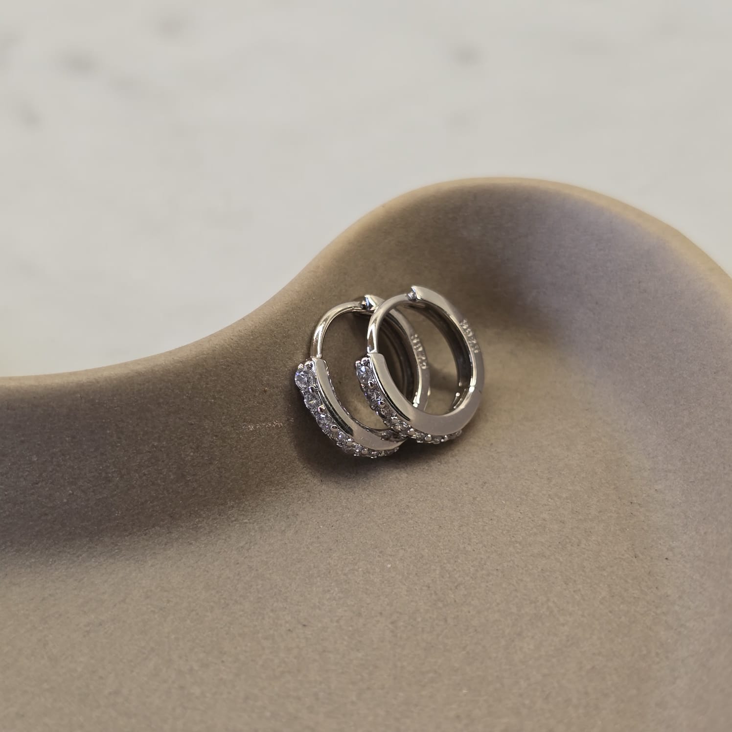 Suprene Collective Zirconia Huggie Earrings in 925 Sterling Silver with CZ stones
